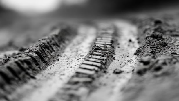 Vehicle tire tracks on earth ground texture photo