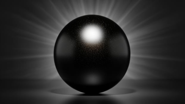 A black egg with a bright light shining from the top photo