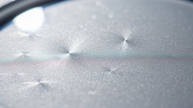 A close up of a silver plate with a white background photo