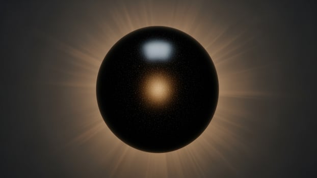 A black sphere with a yellow light shining from it photo