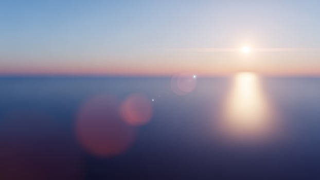 Sunset over the ocean with a bokeh effect photo
