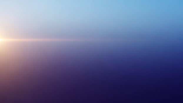 Sunrise over the ocean with blue sky and fog photo