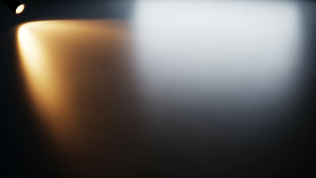 A spotlight is shining on a wall photo