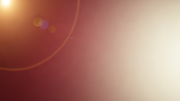 A red and white background with a sun in the center photo