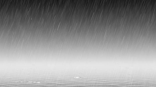 Rainy day with drops of water on the ground photo