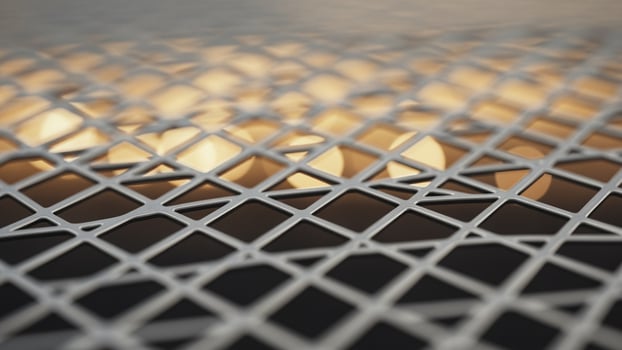 A close up of a metal mesh with lights photo
