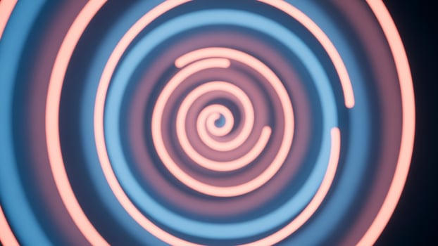 A neon light is spinning in a circle photo