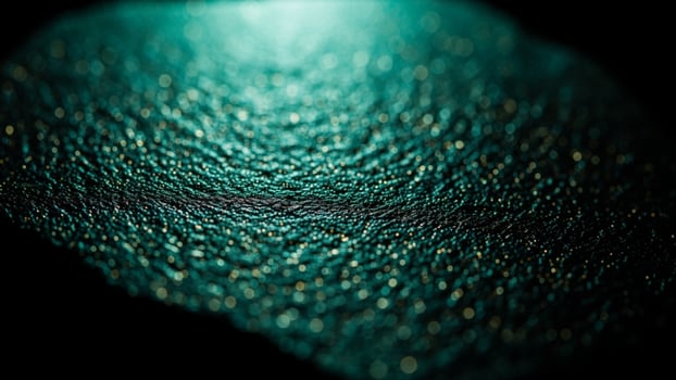 A close up of a green and gold speckled surface photo