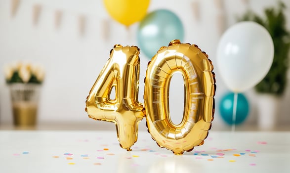 Golden number balloons celebrating a milestone achievement or anniversary event invitation photo