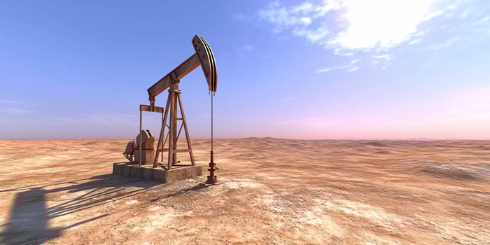 Oil pumpjack in desert environment energy resource extraction photo