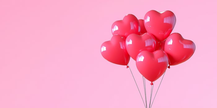 Heart balloons bunch against solid color backdrop for celebrations photo