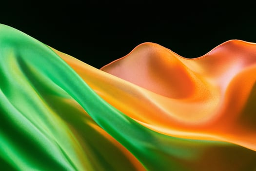Abstract flowing fabric in vibrant green and orange colors on transparent background texture photo