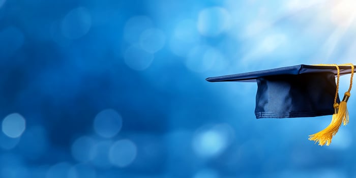 Graduation cap symbol of academic achievement and educational success on abstract blue background photo