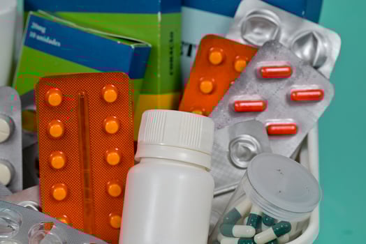 medicines already used and inside a box with other medicines and bottles photo