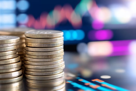 Stack of coins with abstract financial data background for finance and investment photo