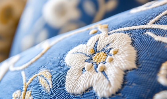 Floral embroidery pattern on blue textile decorative fabric design photo
