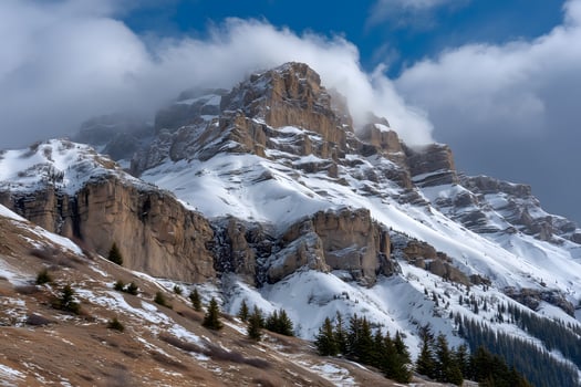 Snow Covered Mountain Peak with Rocky Outcrops and Pine Trees winter landscape photo