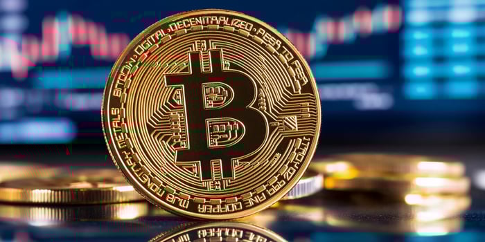 Golden token close up representing finance business and technology photo