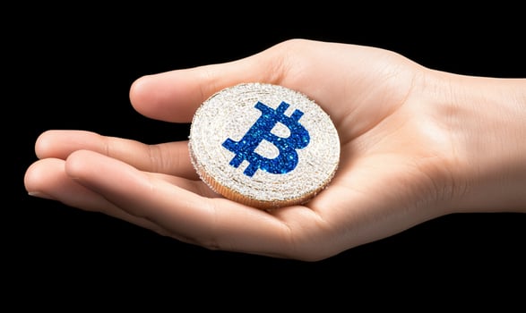Hand holding a digital currency coin investment concept photo