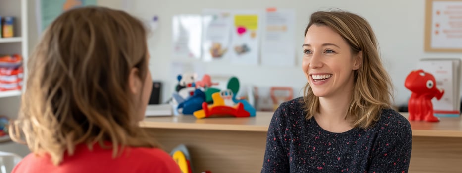 Professional woman talking to colleague in bright office setting photo