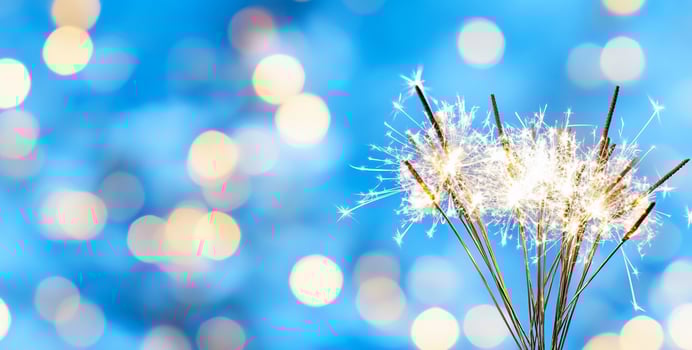 Sparkler celebration against blurred light background festive holiday photo