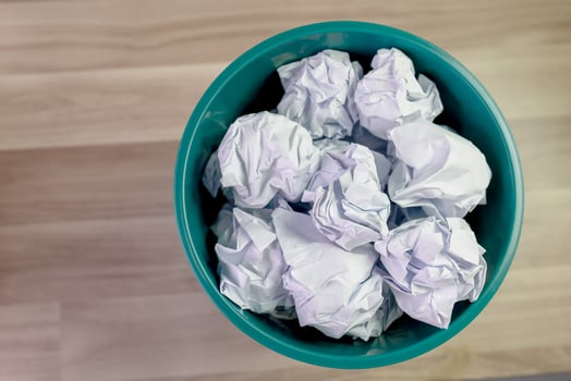 crumpled paper ball in trash can, paper waste, trash bin in office with crumple paper ball, work hard ideas concepts photo