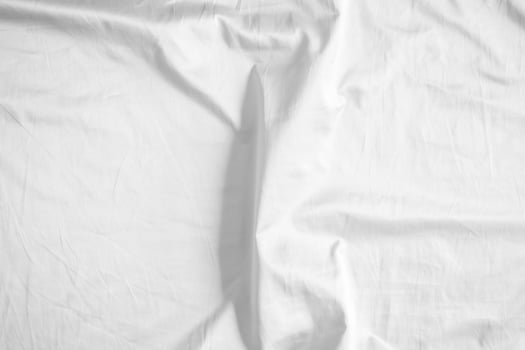 White bed sheet with a white sheet photo