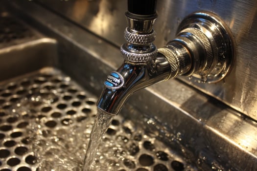 A faucet with water running out of it photo
