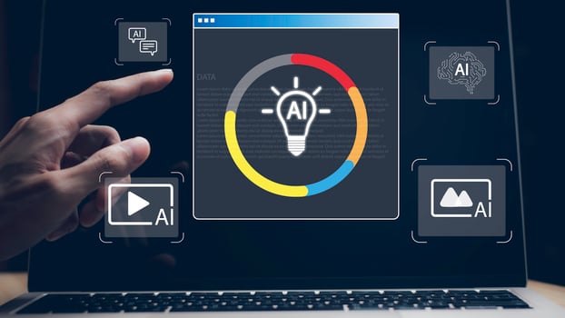 A person is pointing at a computer screen with a light bulb icon photo