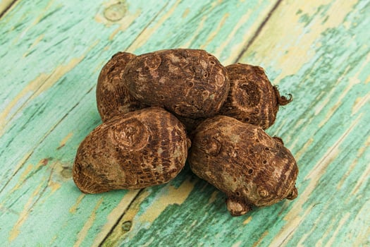 A pile of nuts on a wooden table photo
