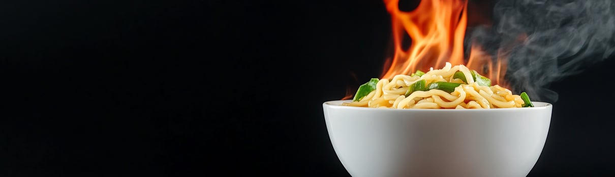 Steaming noodles with fire in white bowl asian cuisine hot meal photo