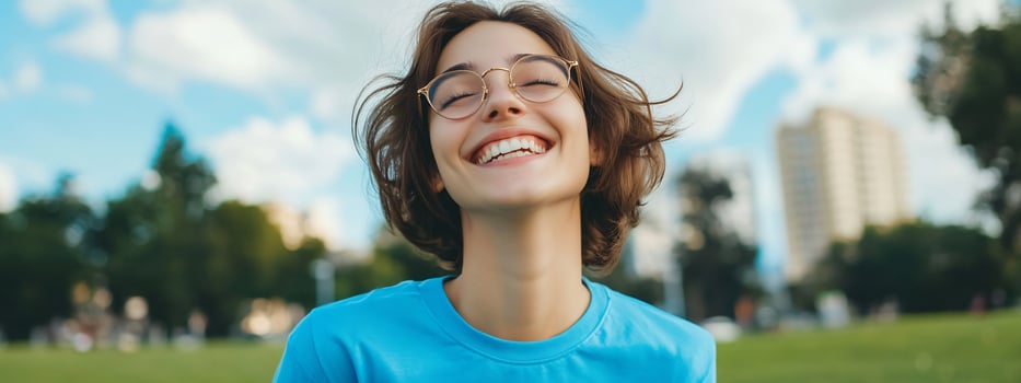 Smiling young adult outdoors portrait cheerful and happy with positive emotions in nature photo