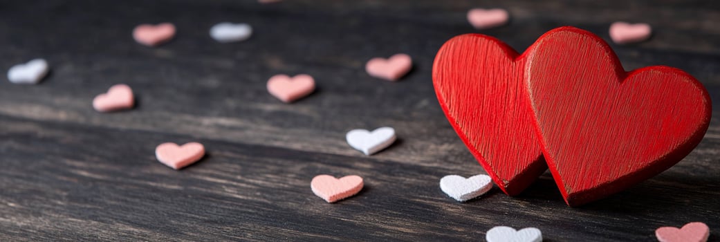 Romantic heart shapes on wood background for valentines day photo