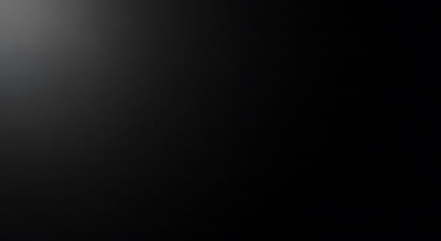 Dark black gradient background with subtle lighting effect for design projects photo
