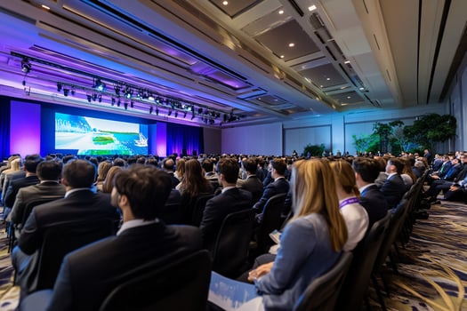 Large business conference auditorium event with audience photo