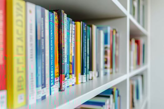 Arrangement of books on a white bookshelf background photo
