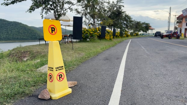 Yellow No Parking Cone Beside the Road photo