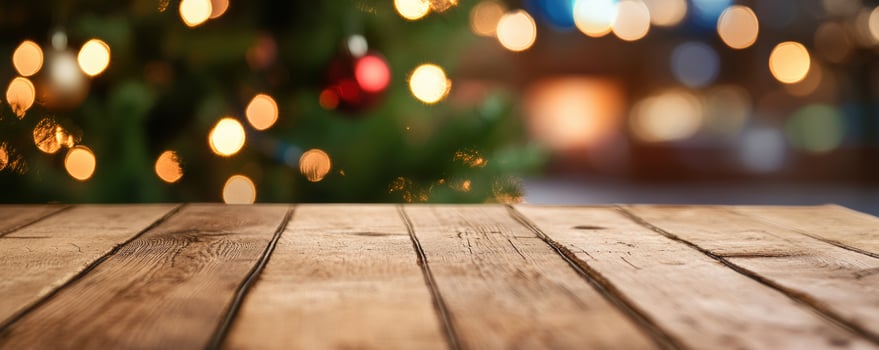 Rustic wood tabletop with festive christmas tree background photo