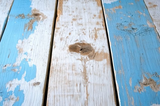 Distressed wood surface with blue and white paint texture background photo