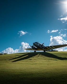 Historic aircraft on display on green hilltop with clear blue sky in background symbolizing aviation heritage and open air museum photo