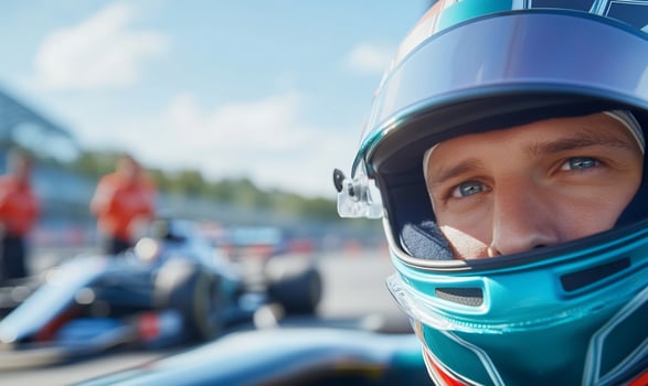 Concentrated race car driver ready for competition on the racetrack photo