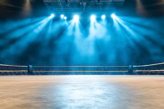 Empty boxing ring under bright spotlights awaiting competition photo