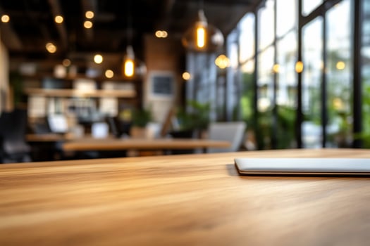 Laptop on wood table in modern office blurred background business technology photo