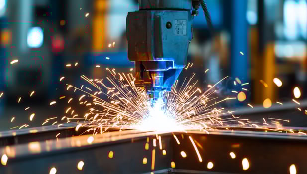 Robotic welding metal with bright sparks in industrial factory photo