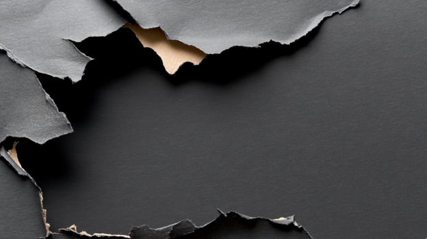 Textured abstract background with torn dark paper fragments photo