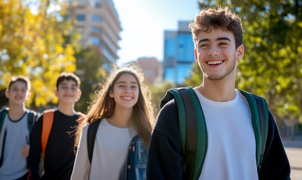 Cheerful students walking together on sunny day outdoor campus education photo