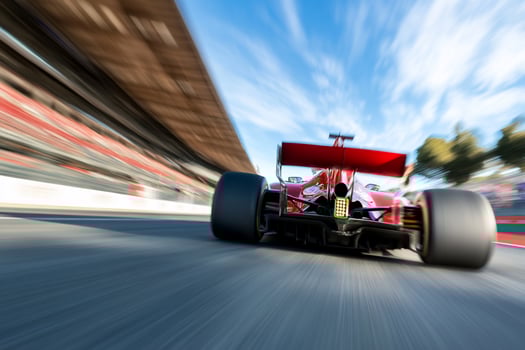 Race car speeding on track fast motion blur photo