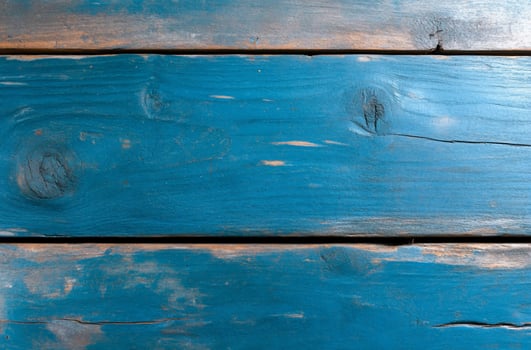 Rustic blue wooden planks surface with distressed paint texture background photo