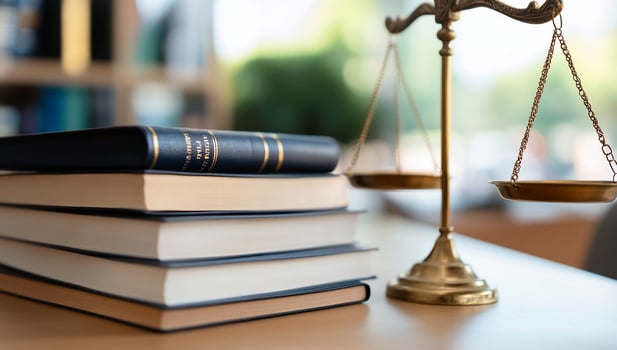 Scales of justice with law books concept photo