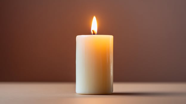 Solitary candlelight warmth and remembrance symbolism photo
